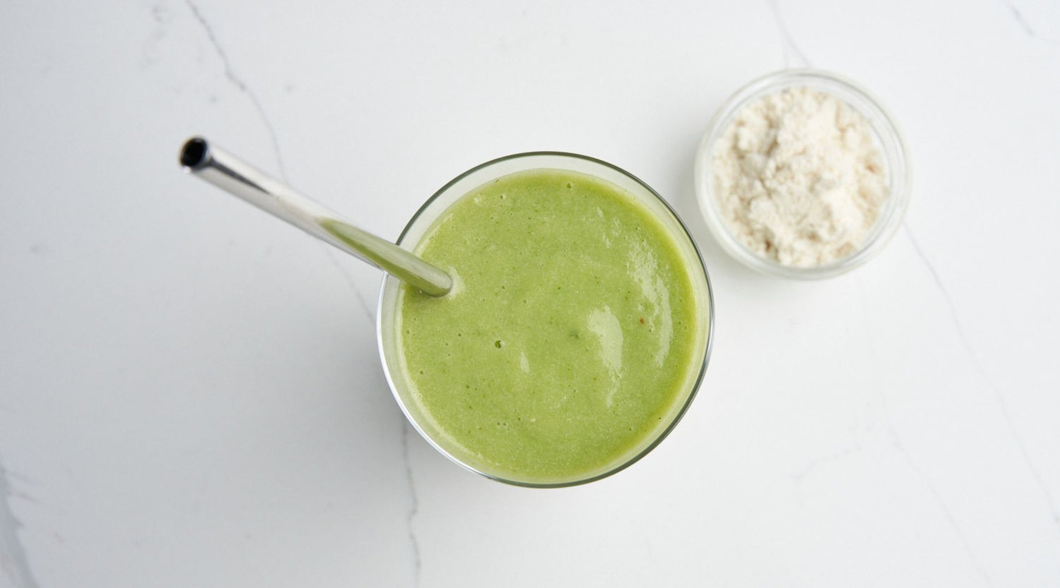 woman making green healthy smoothie